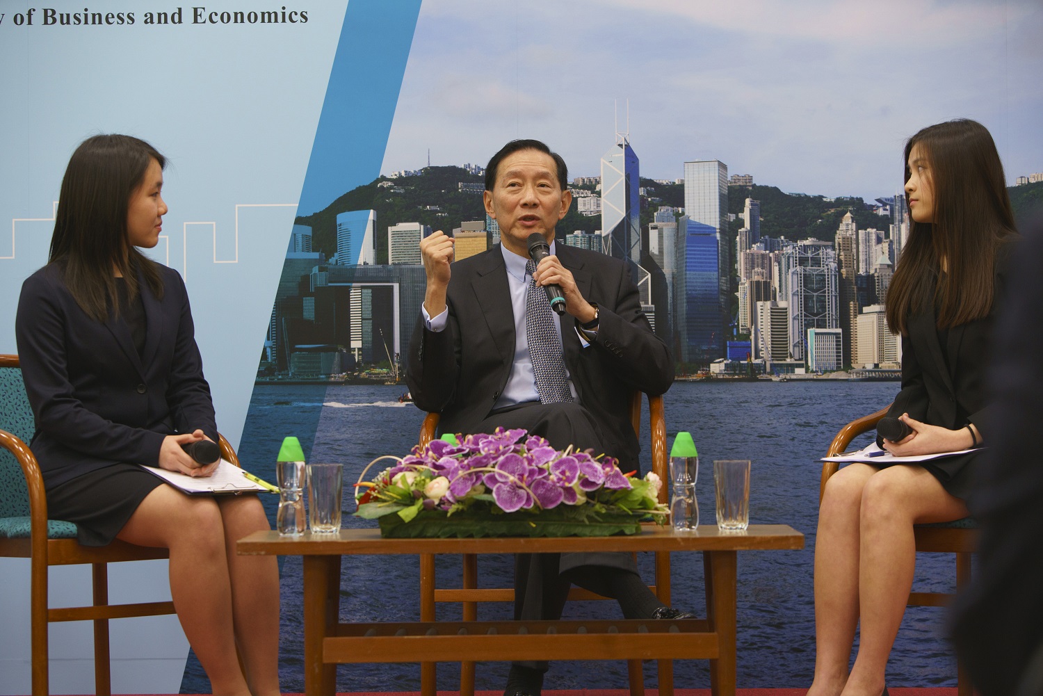 Mr. Peter Wong Tung Shun answers audience’s questions in a Q&A session moderated by two Student Ambassadors.