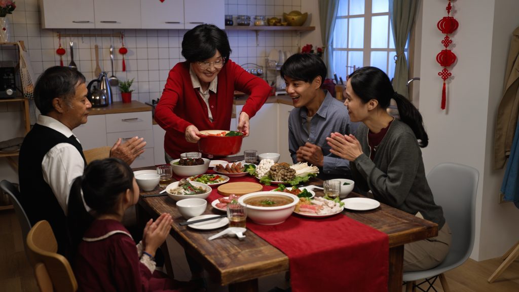 Asian family enjoying dinner during Chinese New Year